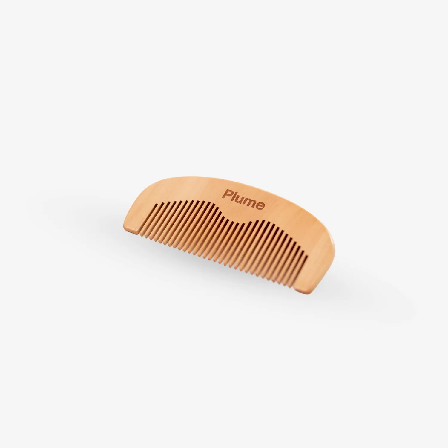Plume förlossningskam i päronträ 10x5 cm